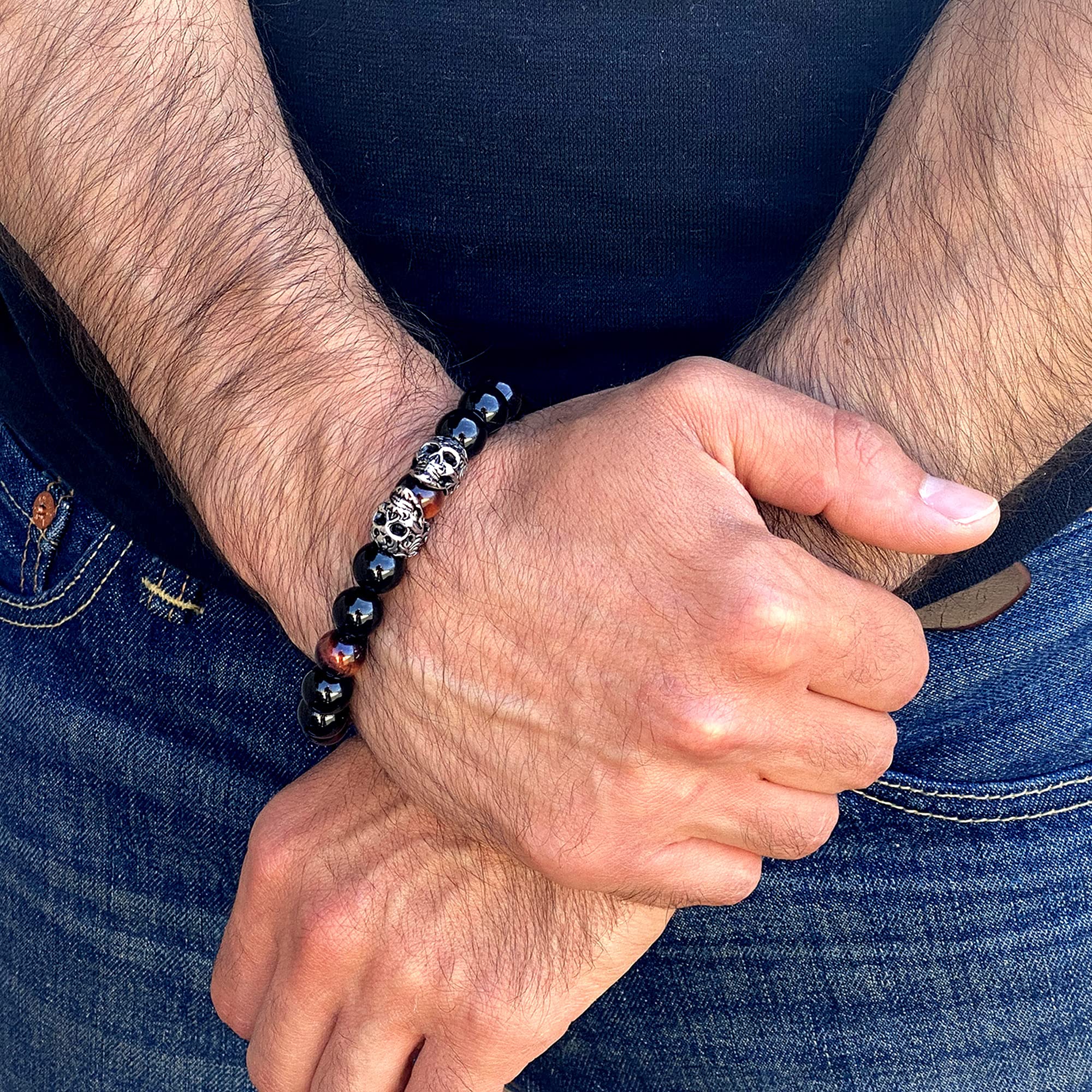 Foto 4 pulgar | Brazalete Crucible Con Doble Calaveras De Acero Inoxidable, Ojo De Tigre Rojo - Venta Internacional.