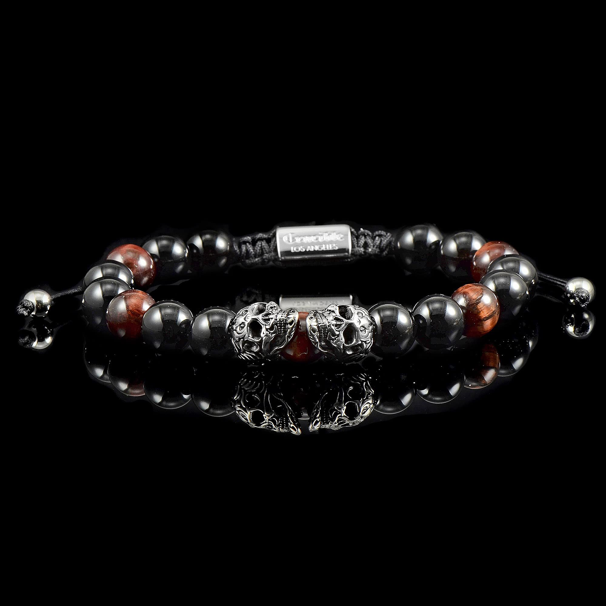 Foto 6 pulgar | Brazalete Crucible Con Doble Calaveras De Acero Inoxidable, Ojo De Tigre Rojo - Venta Internacional.